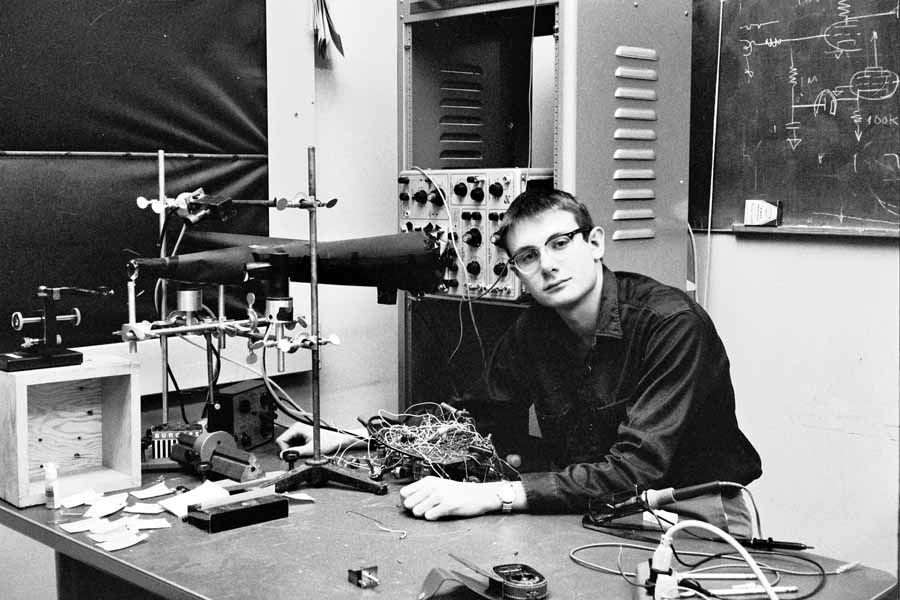 Lee Felsenstein seated in optometry lab at UC Berkeley with keratometer | 102702652 | Computer History Museum