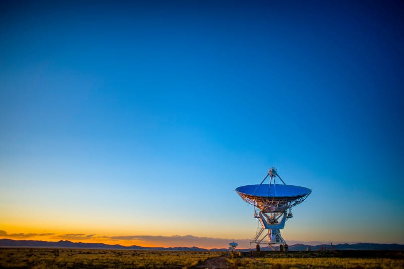 Gray satellite disc on field (Socorro, United States) by Donald Giannatti